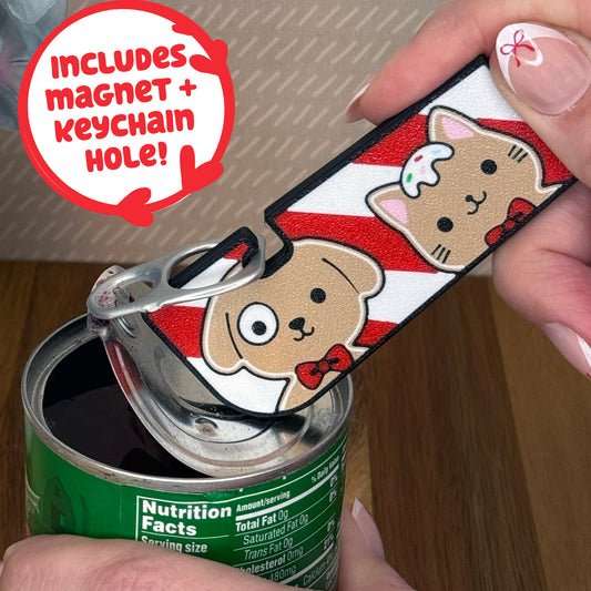 Cute gingerbread dog and cat design Tab Buddy XL is used to open a can. Text notes the Tab Buddy XL includes a magnet and keychain hole.