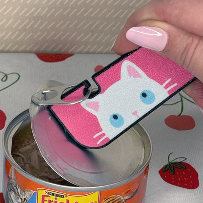 Tab Buddy XL with pink cat design opening a can of Purina Friskies cat food.