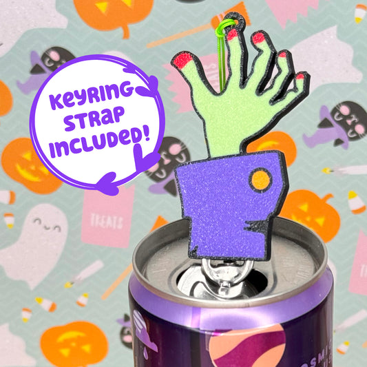 Halloween-themed zombie hand Tab Buddy with included keyring strap on a can with festive background